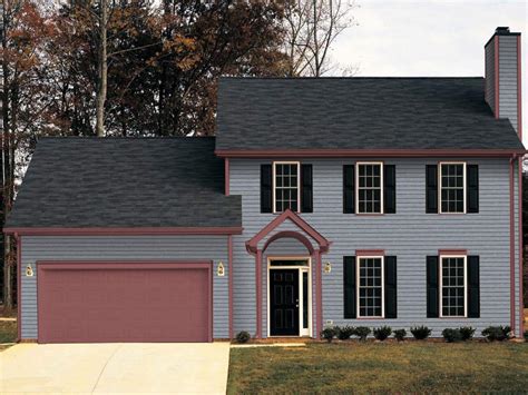 charcoal gray metal roof on white house with red shutters|dark gray white house roof.